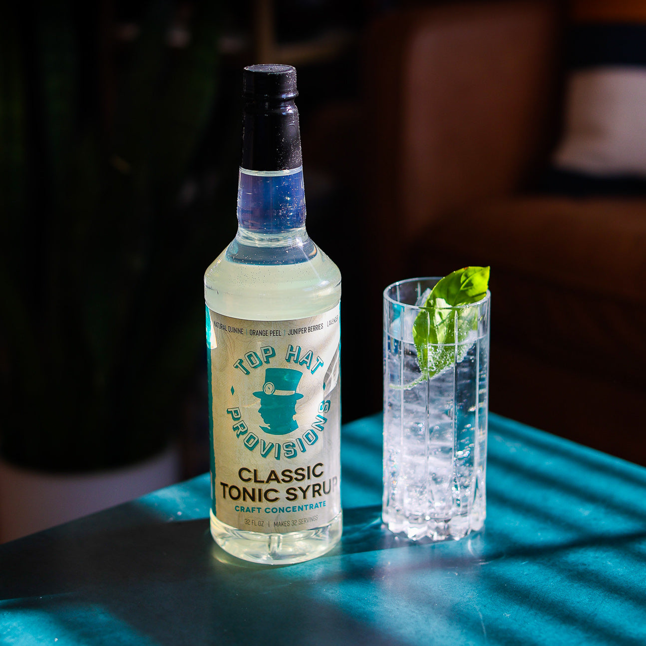 Classic tonic with G&T standing up with basil, square crop