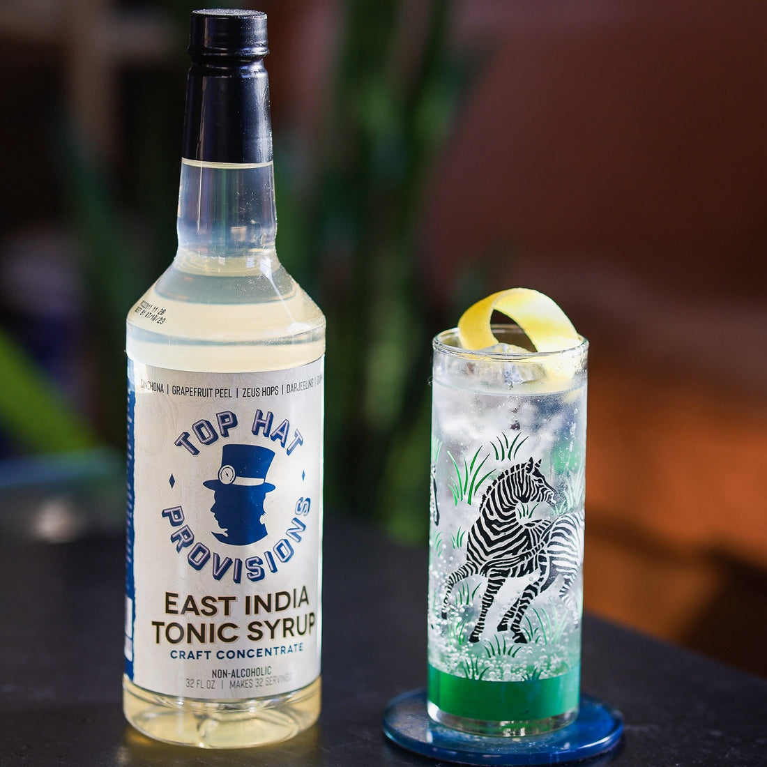 East India Gin Tonic in tall zebra glass, square