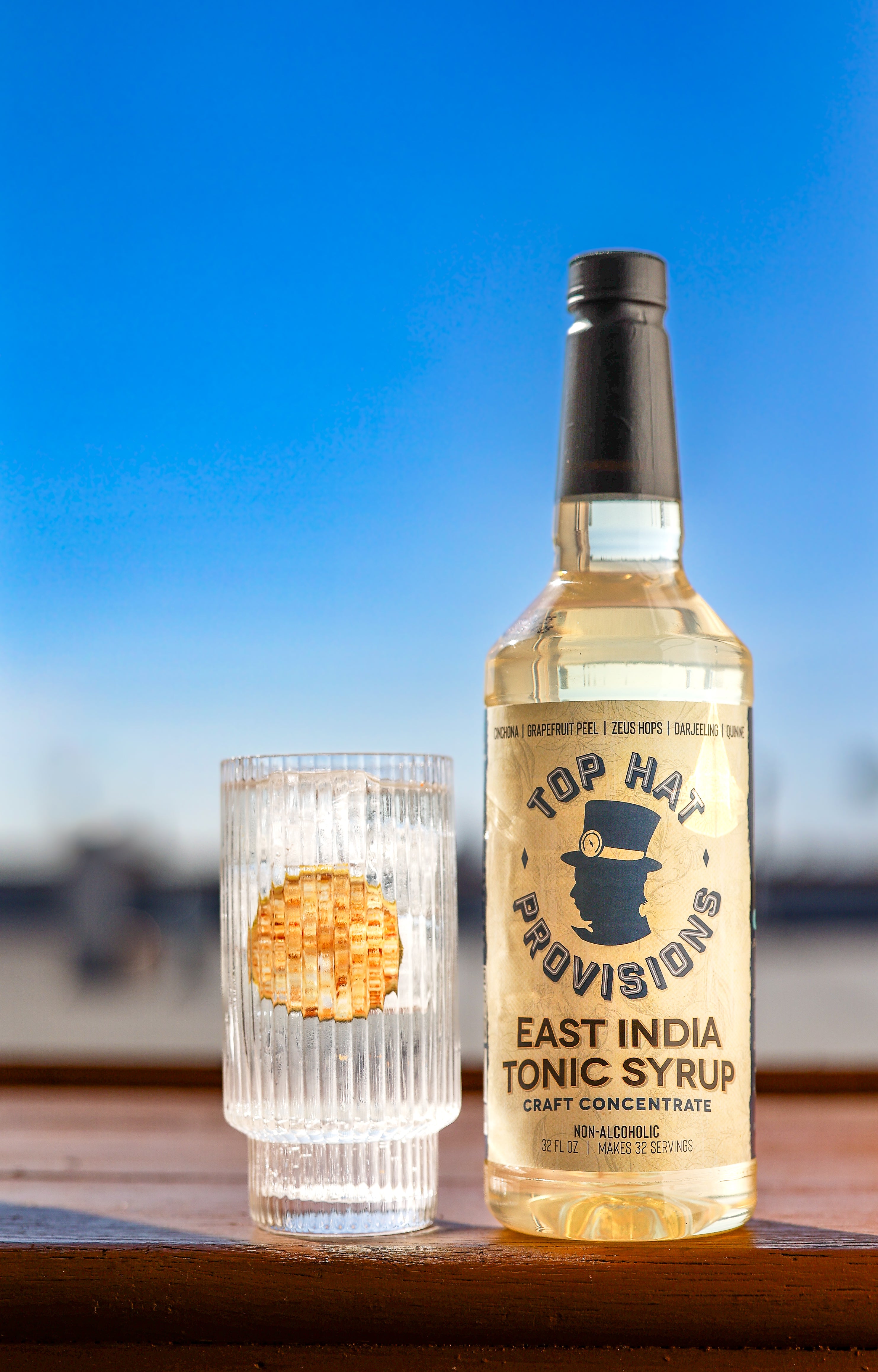 East India Tonic shot with warm sunlight and tall glass of tonic